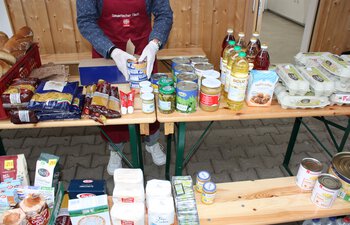 Lebensmittelausgabe "Tisch Messestadt" | © Caritas Oberbayern